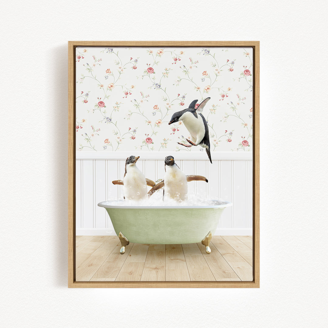 A framed image depicting two penguins sitting in a bathtub, with one penguin jumping out of the tub.