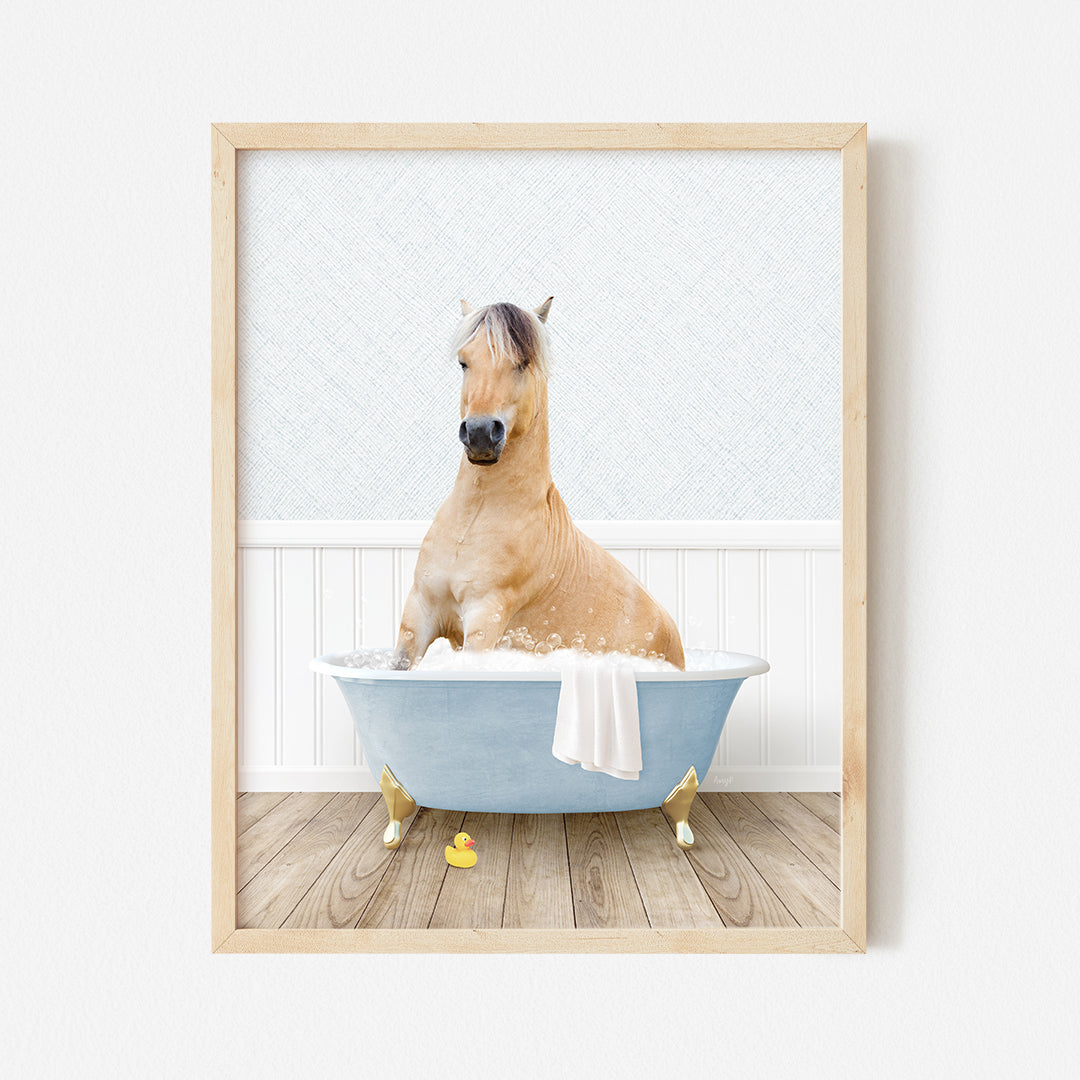 a brown horse sitting in a blue bath tub