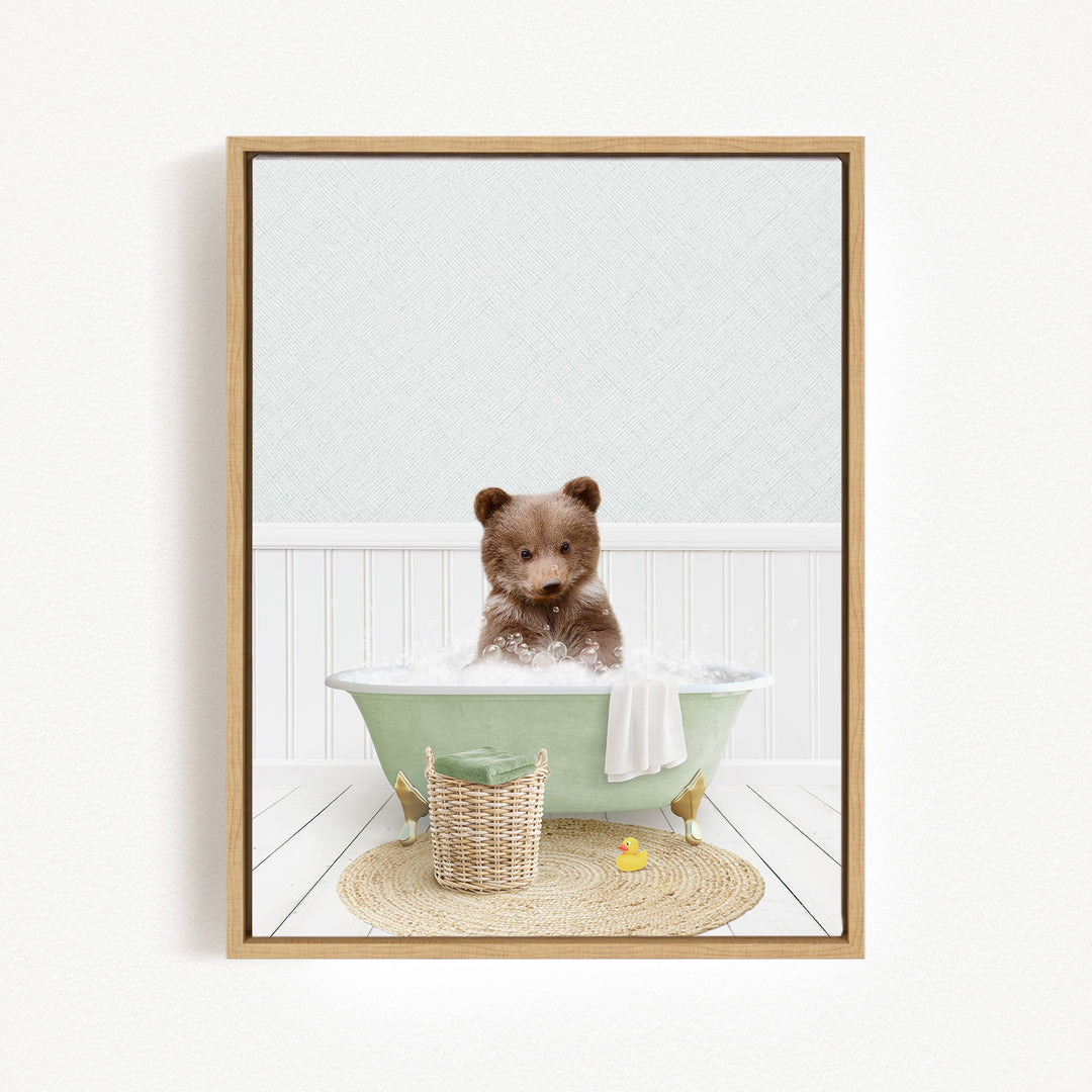 A brown bear sitting in a green bathtub filled with bubbles, surrounded by a basket of toys and a yellow rubber duck.
