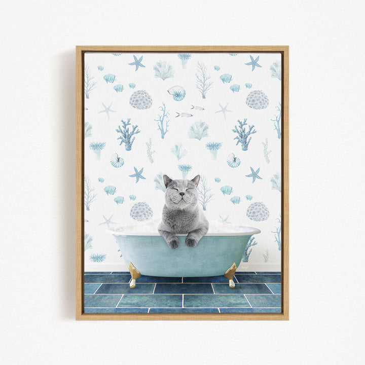 A gray cat sitting in a blue bathtub, surrounded by a pattern of seashells, starfish, and other marine life.