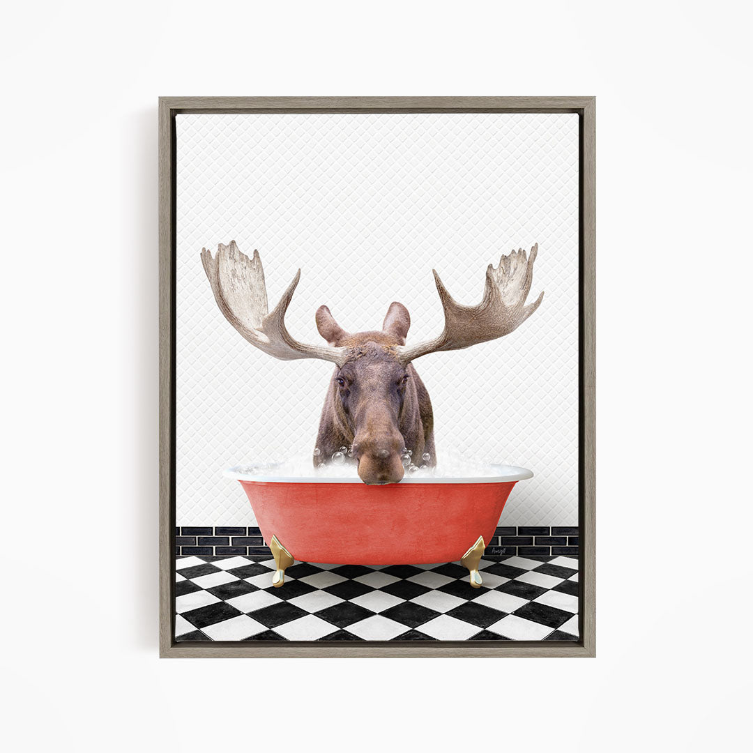 A moose with large antlers is sitting in a red bathtub, surrounded by a black and white checkered floor.