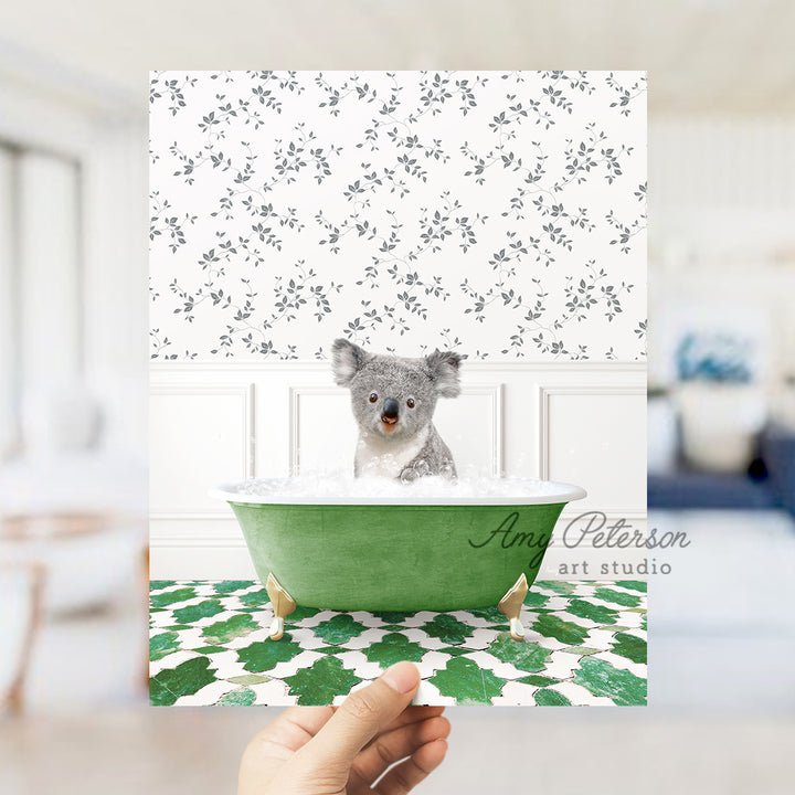 a hand holding a card with a picture of a koala in a bathtub