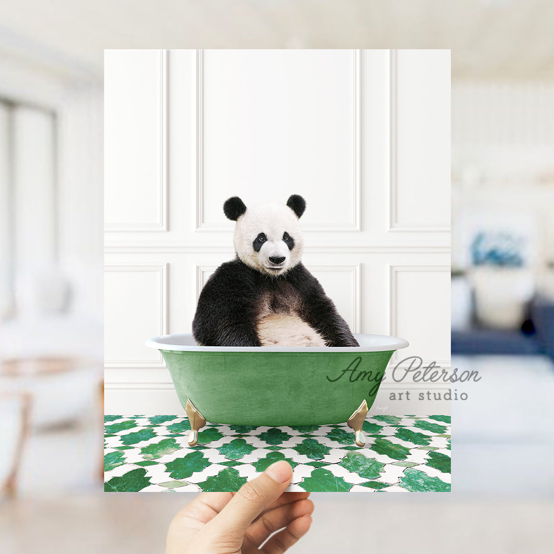 a panda bear sitting in a green bath tub