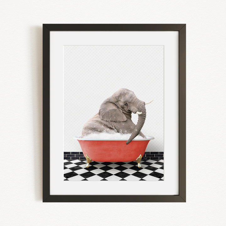 A gray elephant sitting in a red bathtub on a black and white checkered floor.