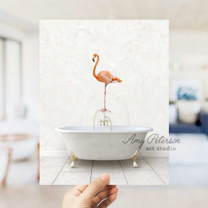 a person holding a photo of a flamingo in a bathtub