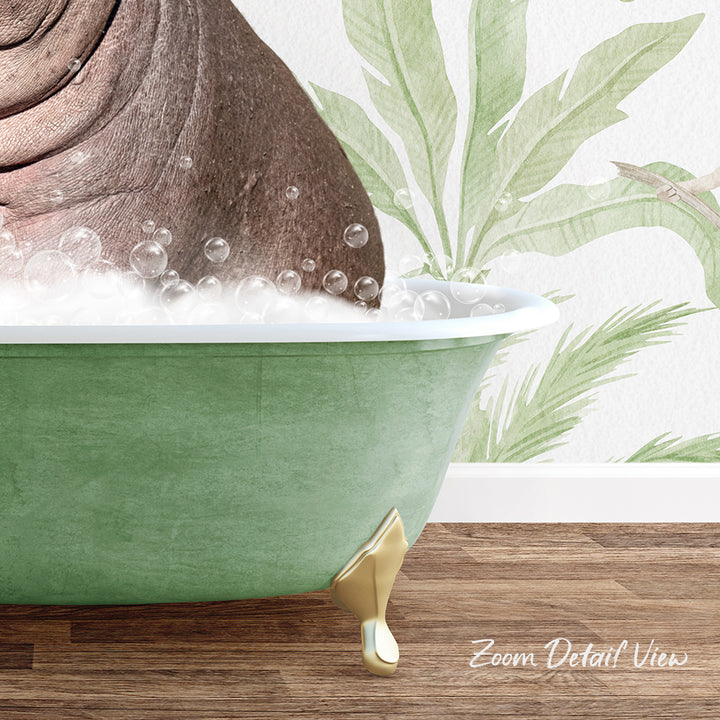 A green bathtub filled with bubbles, with a gold-colored claw-like footrest, and a tropical plant wall hanging in the background.