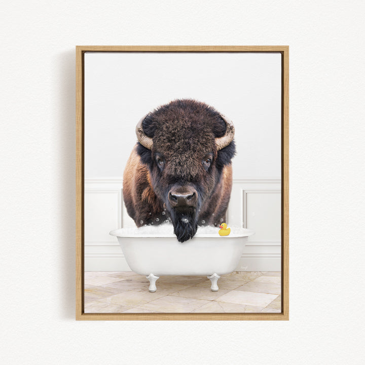 A buffalo with a long beard is standing in a white bathtub, with a rubber duck floating in the water.