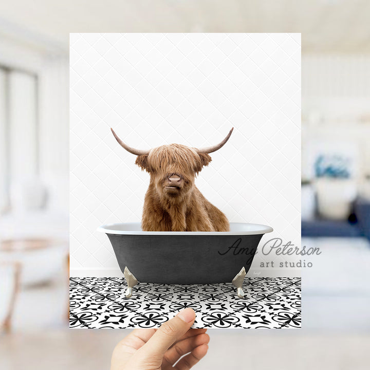 a hand holding up a card with a picture of a bull in a bathtub