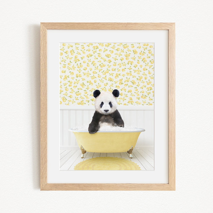 A panda bear sitting in a yellow bathtub, surrounded by a yellow floral pattern on the wall behind it.