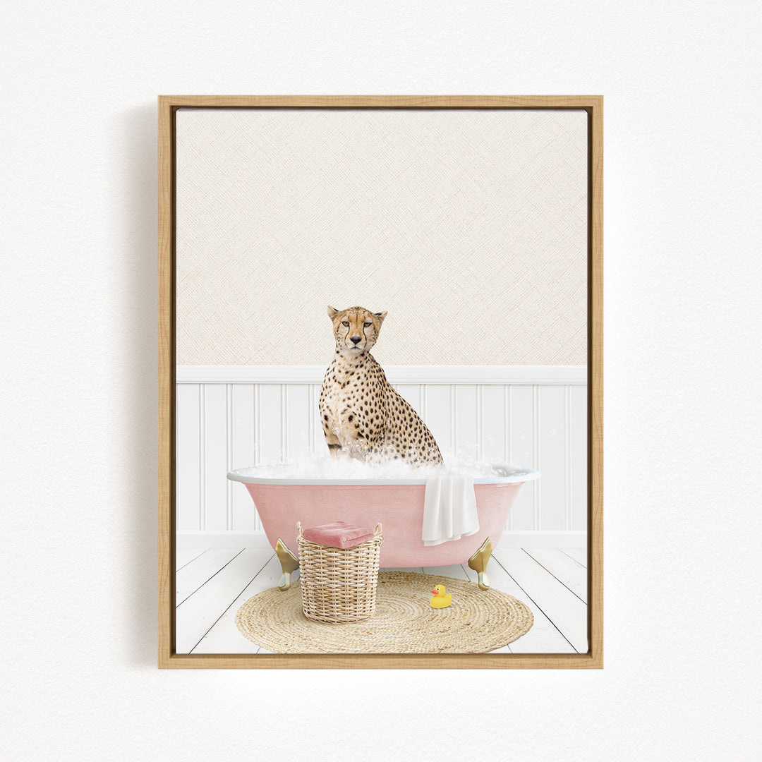 A cheetah sitting in a pink bathtub filled with water, surrounded by a wicker basket and a yellow rubber duck.