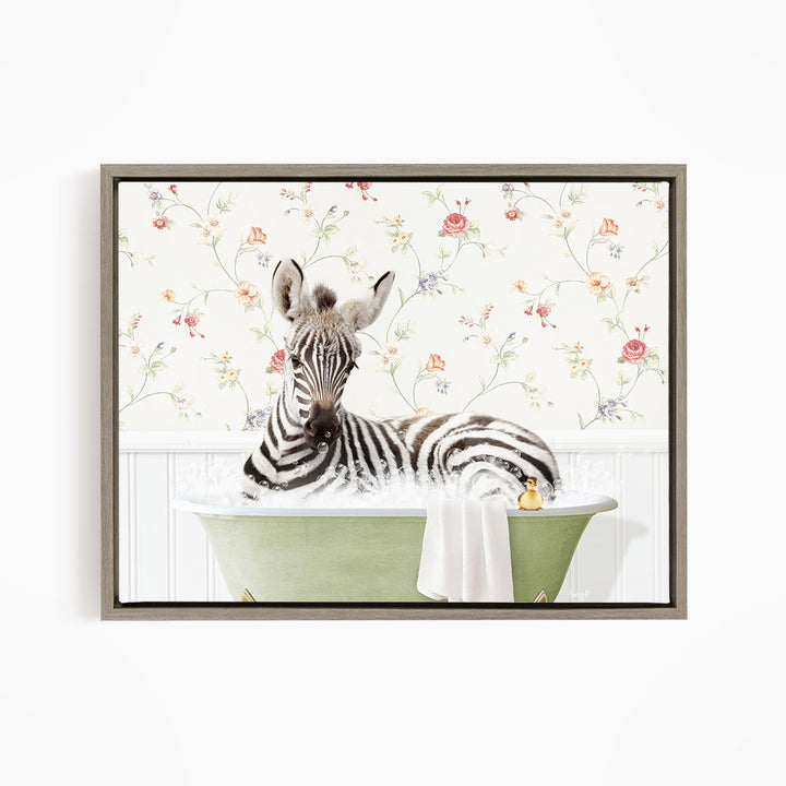 A zebra is sitting in a green bathtub filled with water, surrounded by a floral wallpaper.