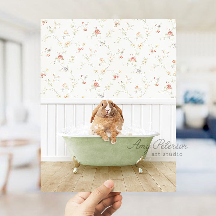 a person holding up a picture of a rabbit in a bathtub