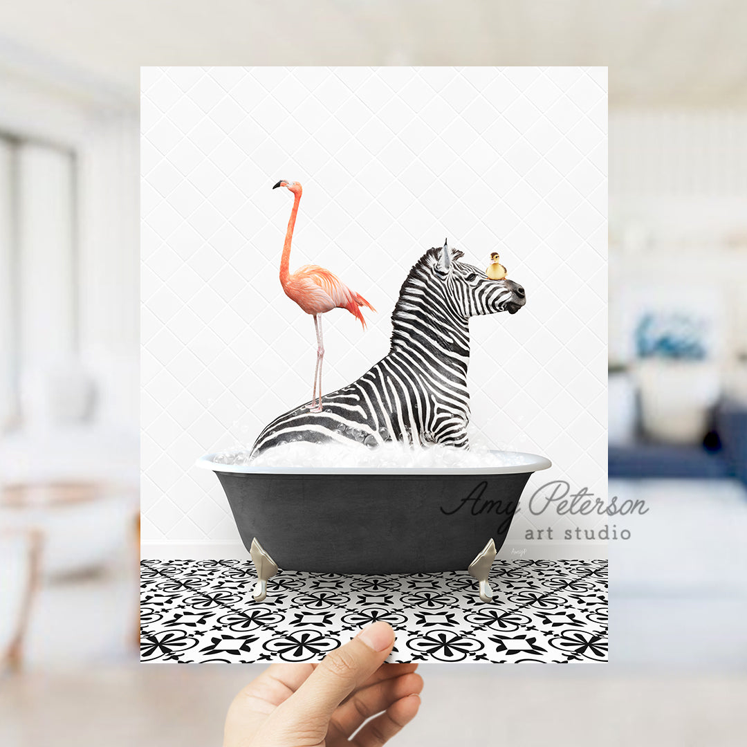 a hand holding a card with a zebra and a flamingo in a bathtub