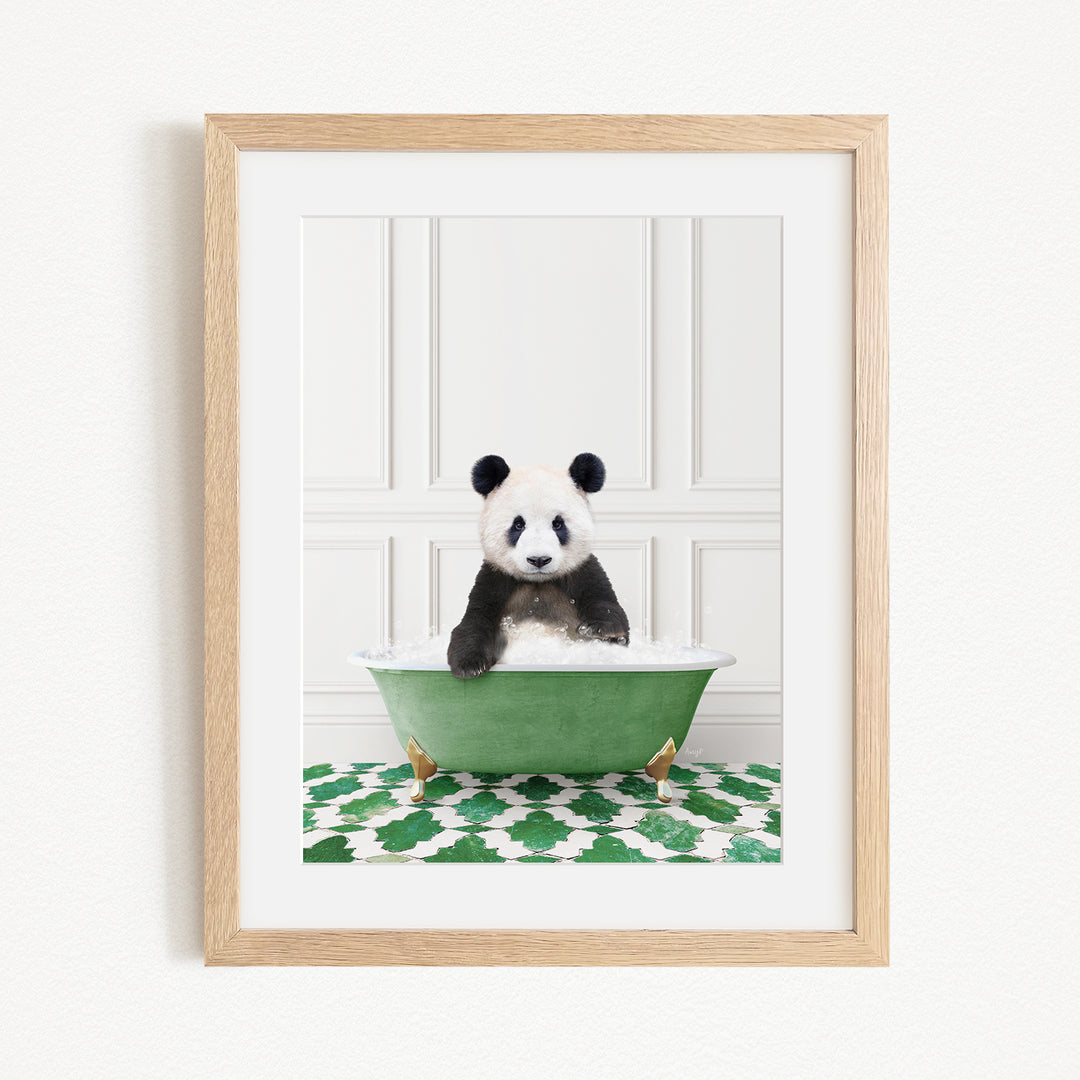 A panda bear sitting in a green bathtub filled with bubbles, surrounded by a green and white patterned rug.