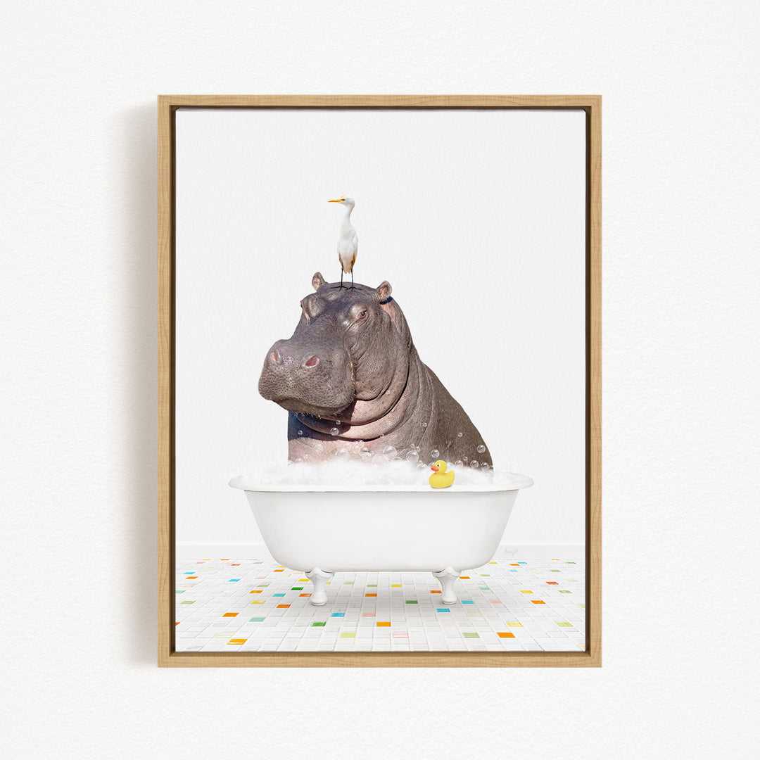 A framed image depicting a hippopotamus sitting in a bathtub, with a bird perched on its head.