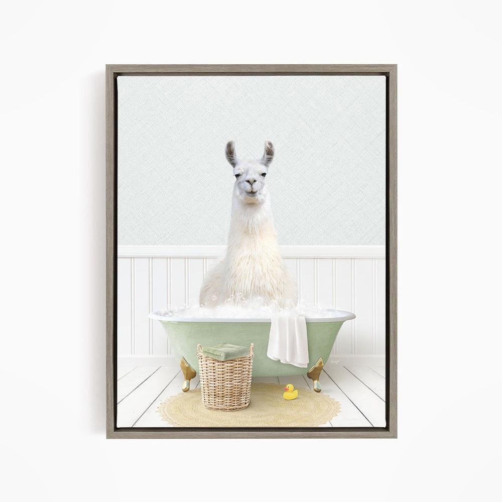 A white llama sitting in a green bathtub filled with bubbles, surrounded by a basket of toys and a yellow rubber duck.