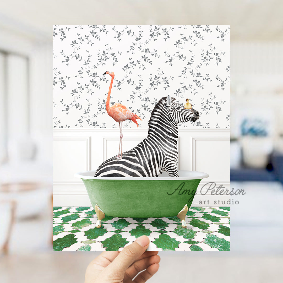 a hand holding a card with a zebra and a flamingo in a bathtub