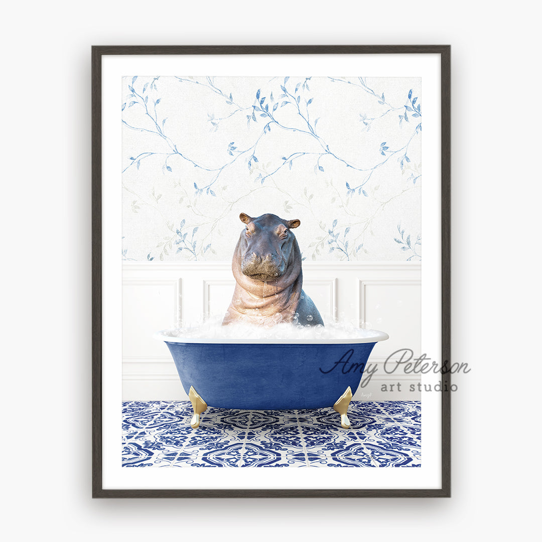 a hippo sitting in a blue bath tub