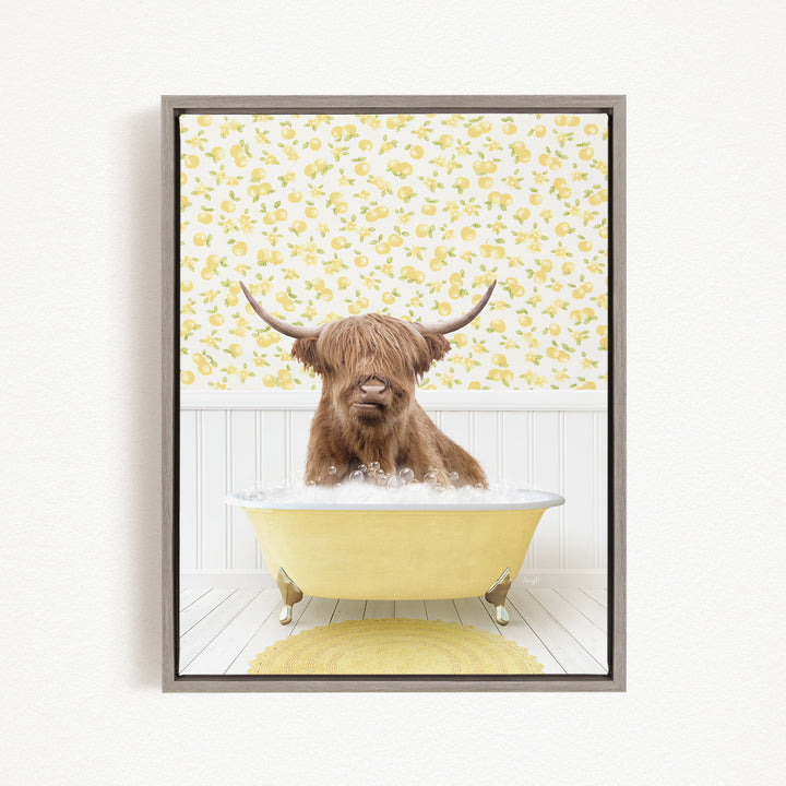 A brown cow with long horns is sitting in a yellow bathtub filled with bubbles, surrounded by a yellow floral wallpaper.