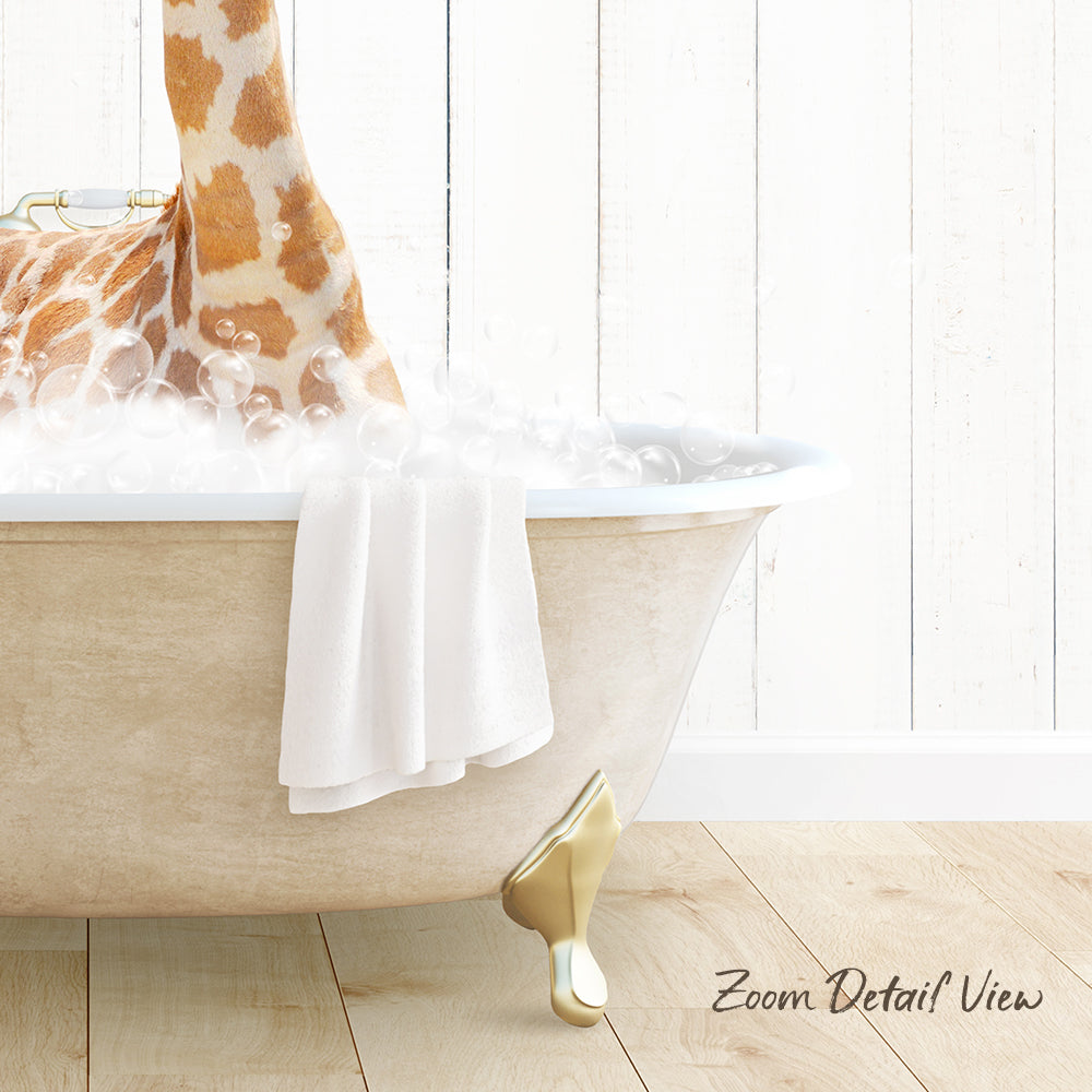 A giraffe standing in a bathtub filled with bubbles, with a towel and gold bathtub leg visible.