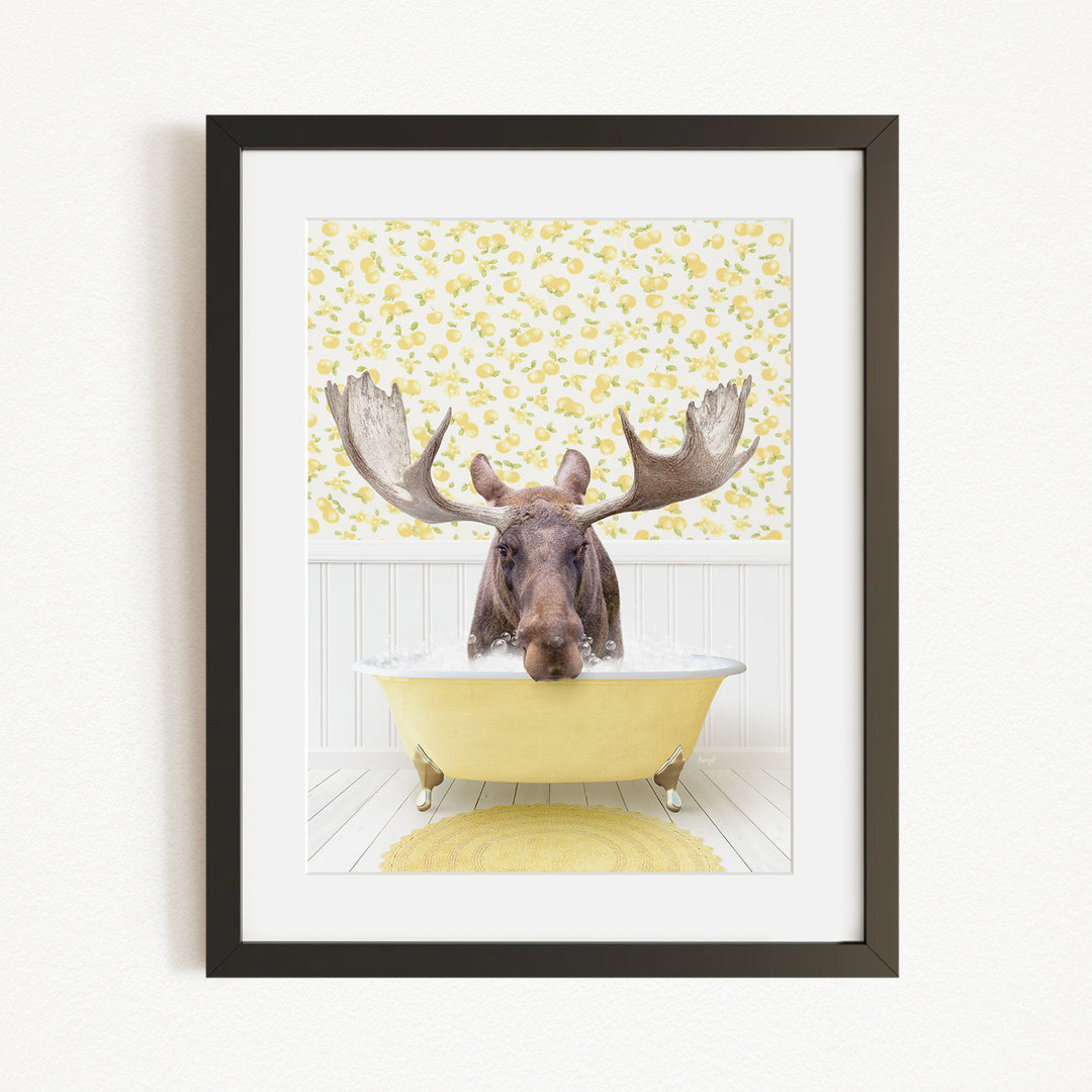 A moose with large antlers is sitting in a yellow bathtub, surrounded by a yellow floral pattern on the wall behind it.
