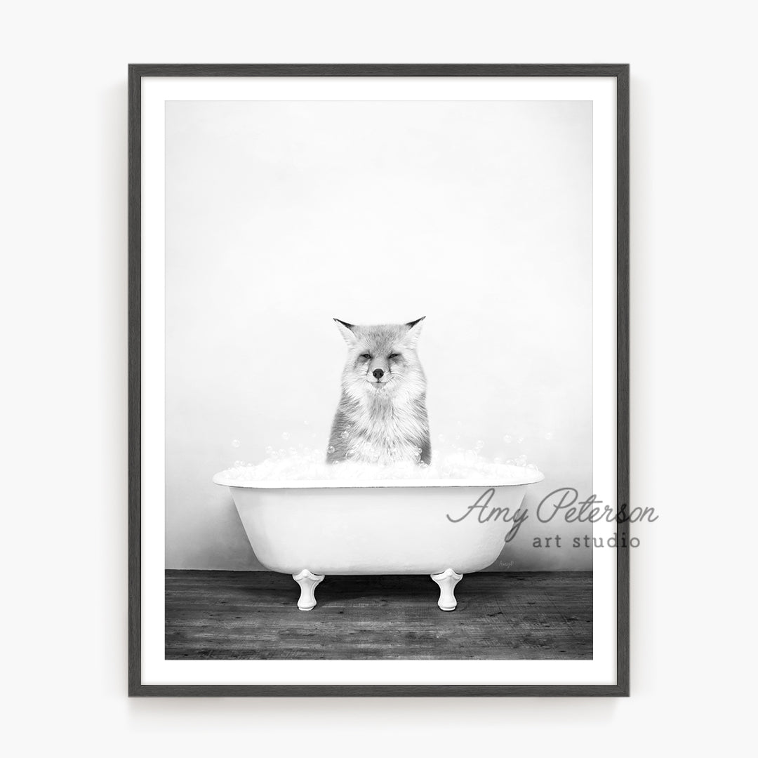 a black and white photo of an owl in a bathtub