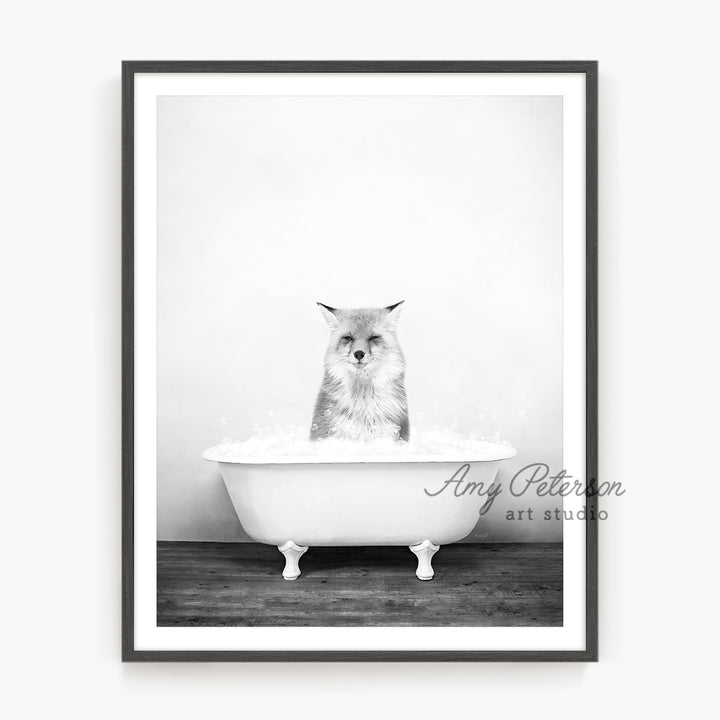 a black and white photo of an owl in a bathtub