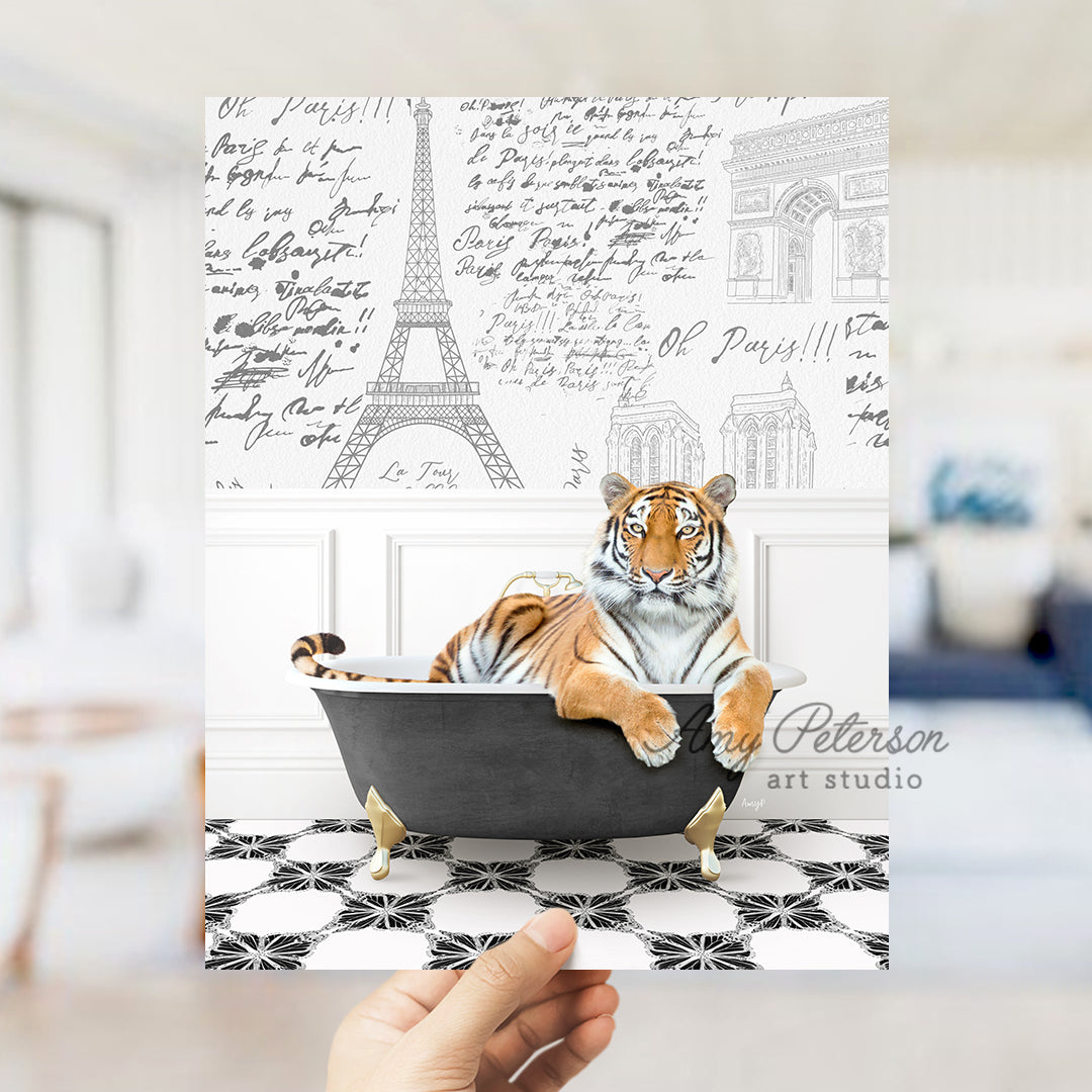 a hand holding up a card with a tiger in a bathtub