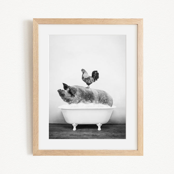 A rooster stands on a pig's back in a bathtub, creating a whimsical and humorous scene.