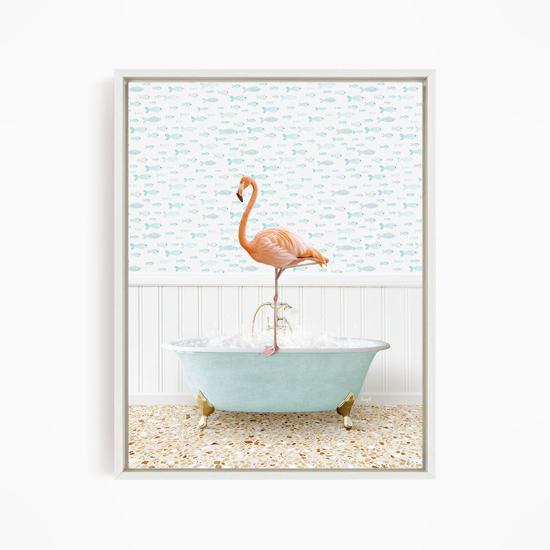 A pink flamingo stands on the edge of a light blue clawfoot bathtub, with a patterned tile floor and a backdrop of fish-themed wallpaper.