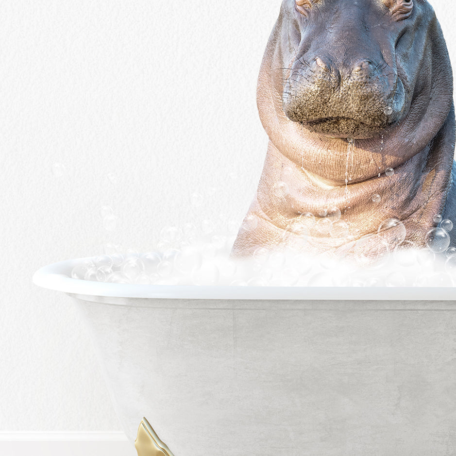 a hippopotamus sitting in a bathtub with bubbles