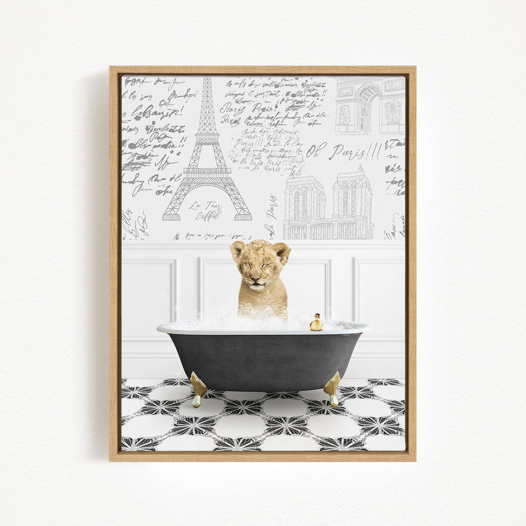 A young lion cub sitting in a bathtub filled with water, surrounded by a wall with various inscriptions and illustrations.