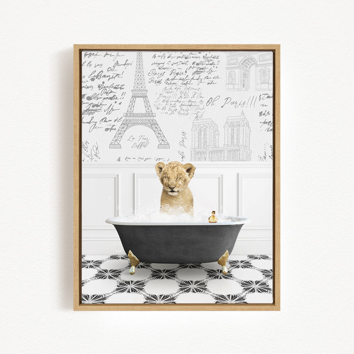 A young lion cub sitting in a bathtub filled with water, surrounded by a wall with various inscriptions and illustrations.