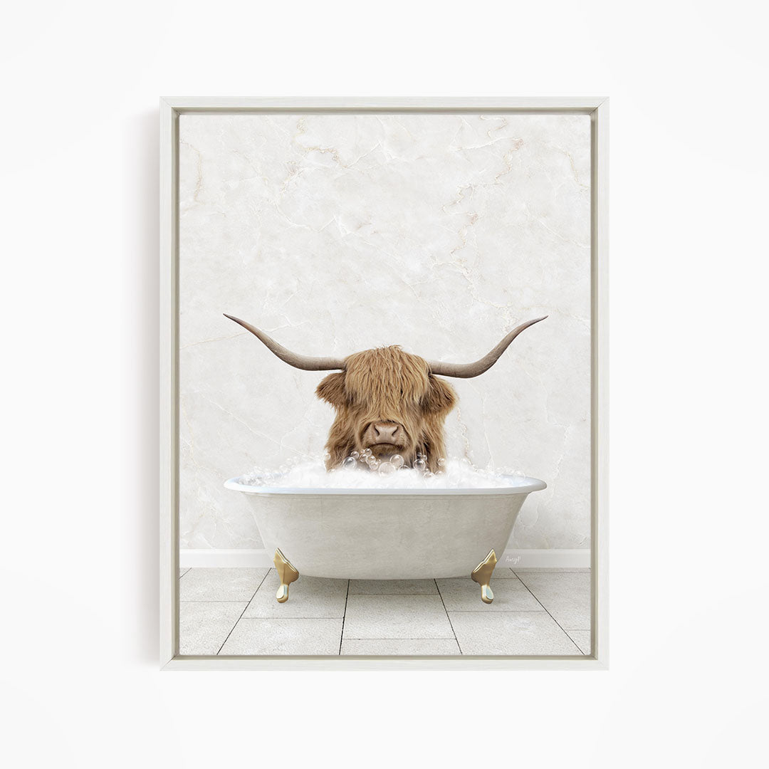A Highland cow with large horns is sitting in a white bathtub filled with water, creating a whimsical and playful scene.