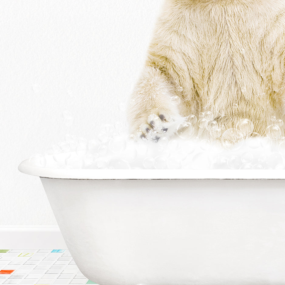 a polar bear sitting in a bathtub full of bubbles