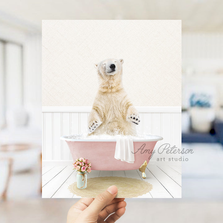 a polar bear sitting in a pink bath tub