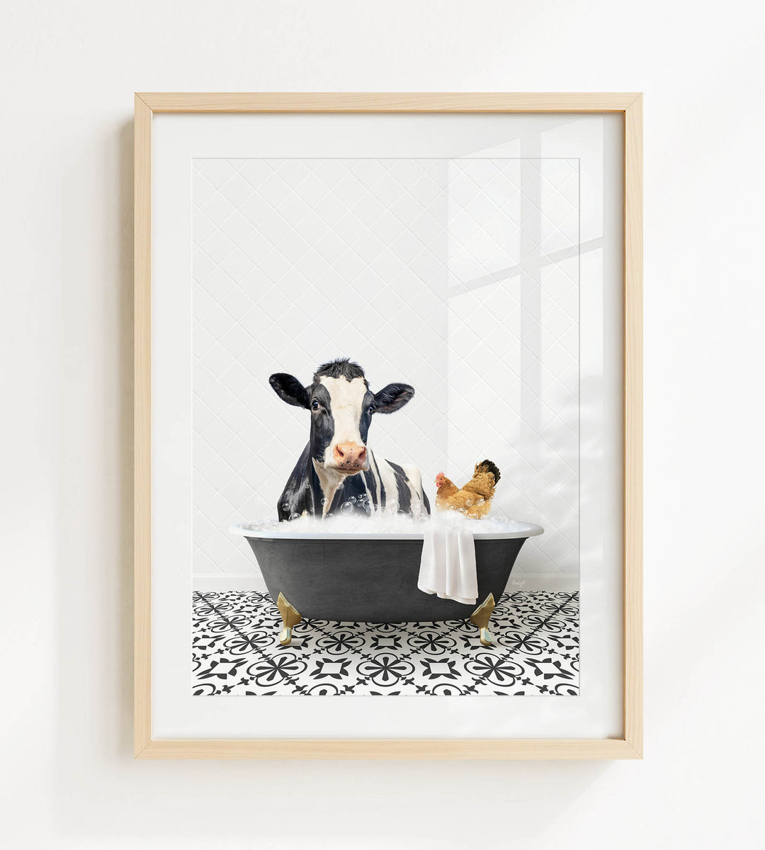 A black and white cow is sitting in a bathtub filled with water, with a chicken nearby.