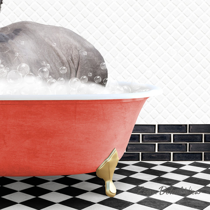 A red bathtub filled with bubbles, with a gray elephant sitting inside.