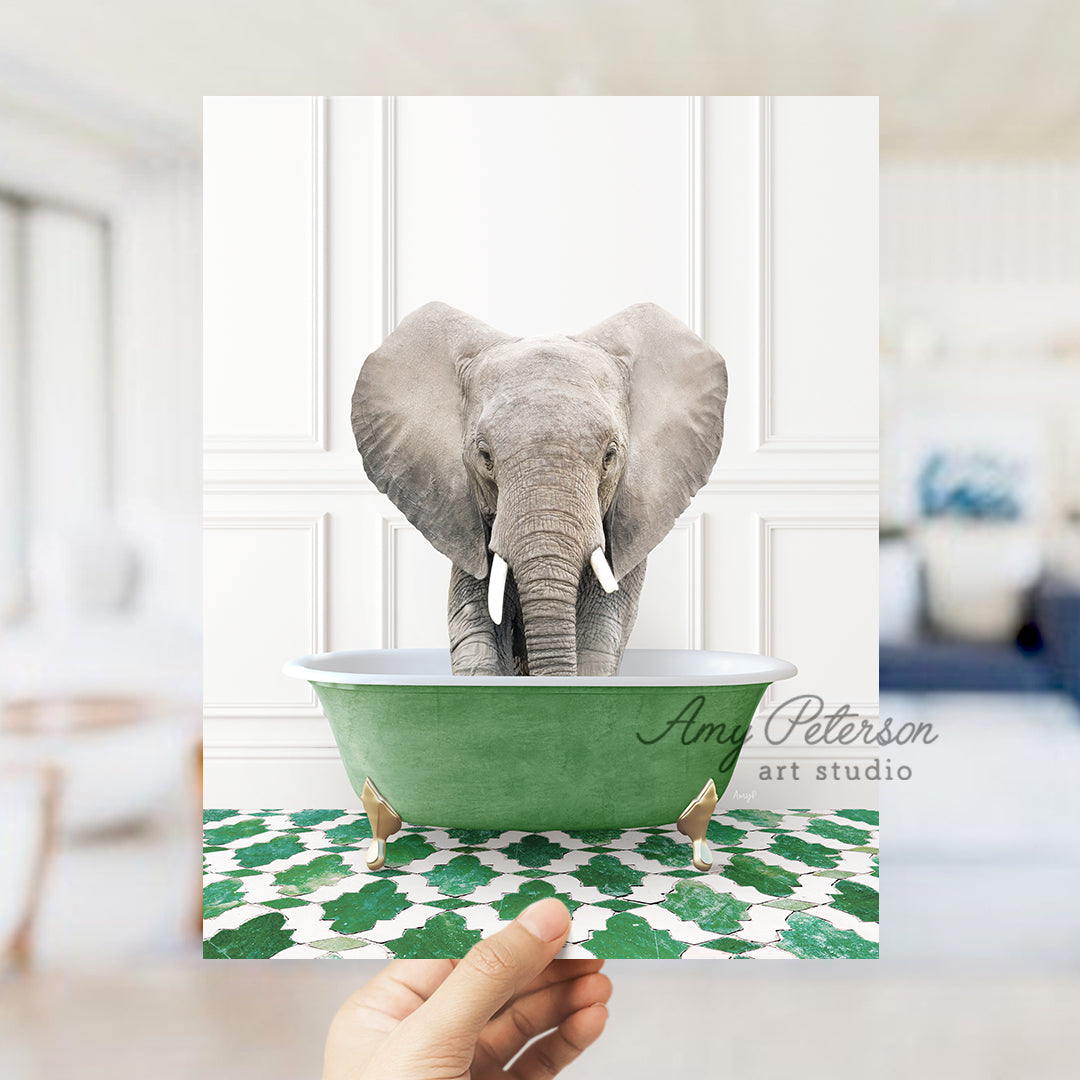 a hand holding a card with an elephant in a bathtub