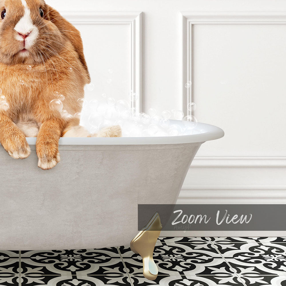 A cute orange rabbit sitting in a white bathtub filled with bubbles, with a black and white patterned floor in the background.