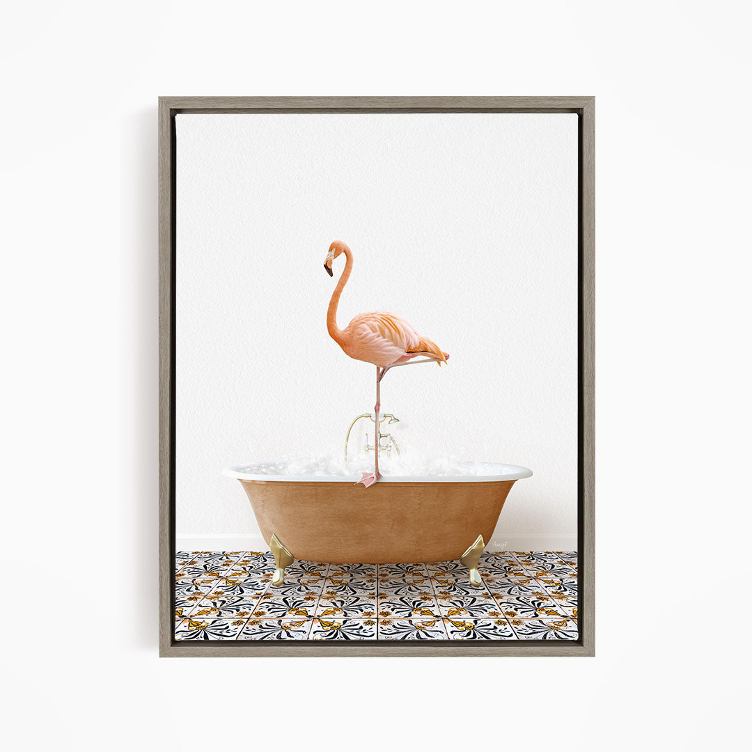 A pink flamingo standing on one leg in a bathtub filled with bubbles, set against a white background with a patterned tile floor.