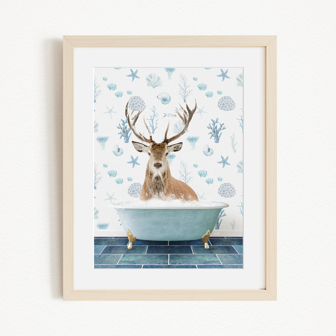 A deer with antlers is sitting in a bathtub filled with bubbles, surrounded by a blue and white patterned background.