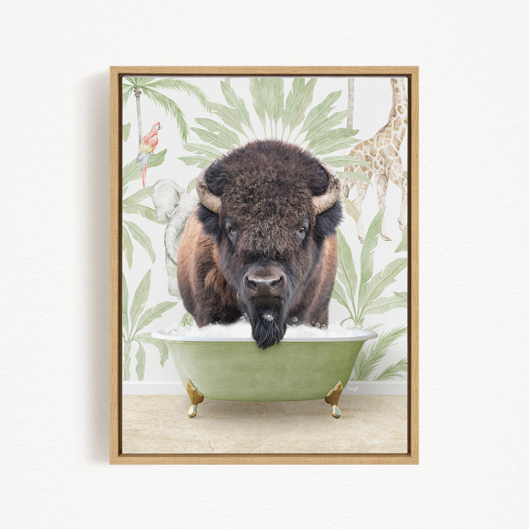 A buffalo is sitting in a green bathtub, surrounded by tropical foliage and a giraffe in the background.