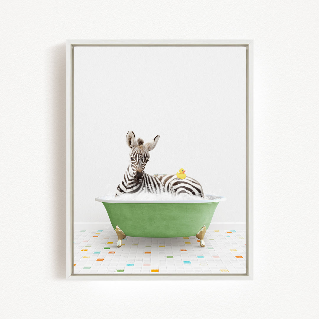 A zebra is sitting in a green bathtub filled with water, with a rubber duck floating on the water's surface.
