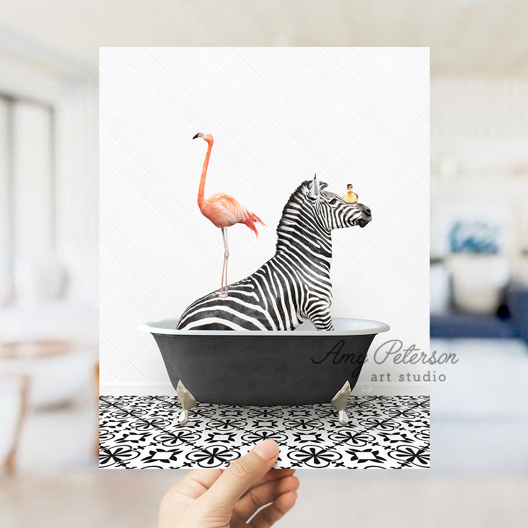 a hand holding a card with a zebra and a flamingo in a bathtub