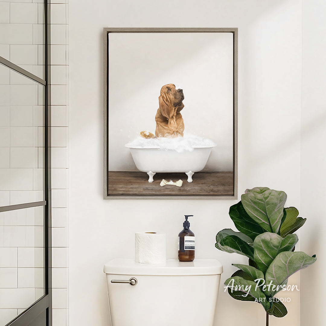 A framed image of a dog sitting in a bathtub, surrounded by a white bathtub, a toilet, and a potted plant in a bathroom setting.