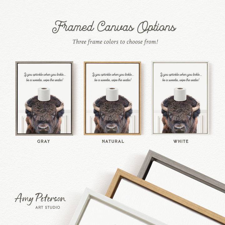 The image is a framed canvas with three different color options for the frame, including gray, natural, and white. The canvas features a picture of a bison with a roll of toilet paper on its head.