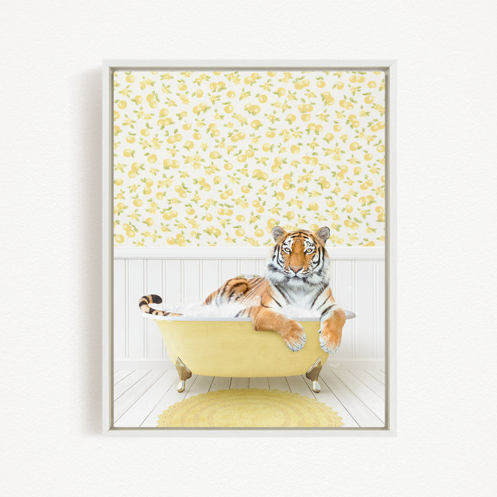 A tiger is sitting in a yellow bathtub, surrounded by a yellow and white floral patterned wall.