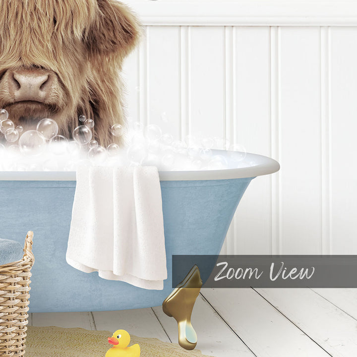 A large, shaggy-haired dog is sitting in a blue bathtub filled with bubbles, surrounded by a yellow rubber duck and a white towel.