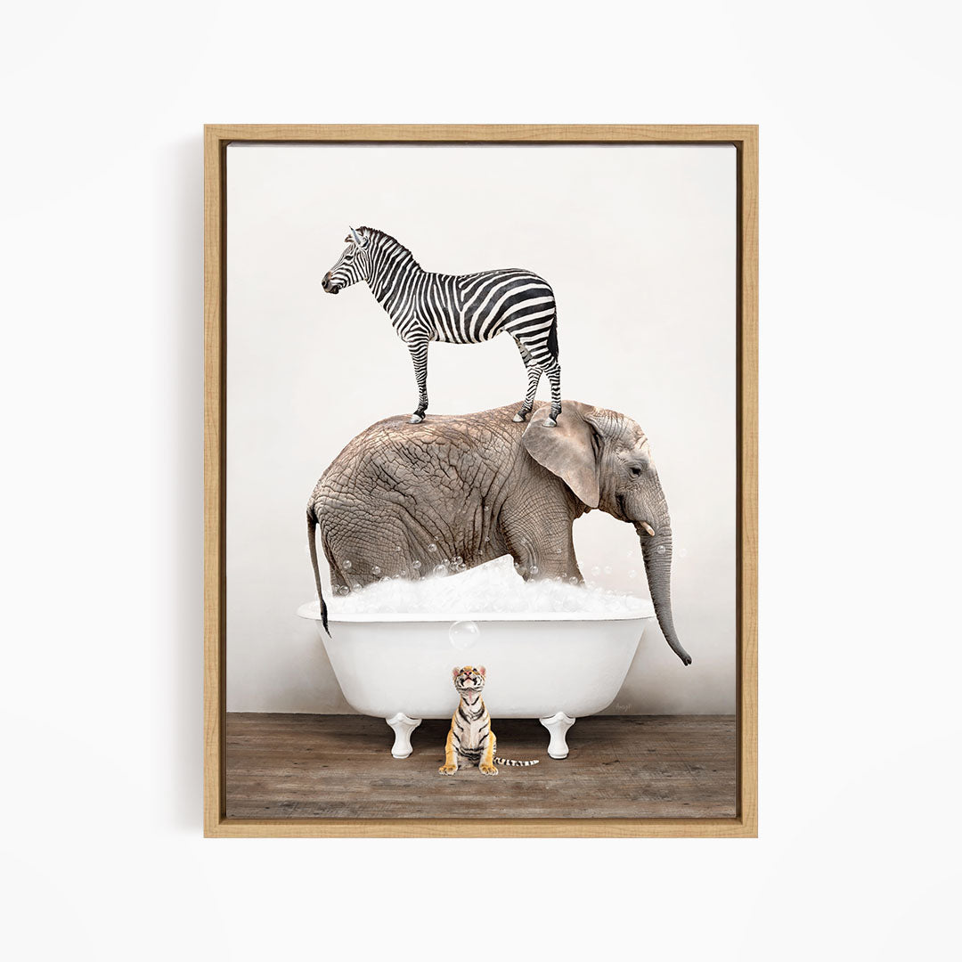 A zebra stands on an elephant's back, while an elephant is submerged in a bathtub, with a small tiger figurine sitting in the tub in front of the elephant.